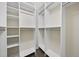 Well-organized walk-in closet with ample shelving and rods for storage at 622 Lone Pine Loop, Fuquay Varina, NC 27526
