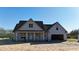 Charming new construction home with a two-car garage and a covered porch in a quiet neighborhood at 6312 River Rd, Fuquay Varina, NC 27526