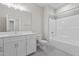 Bathroom features a single sink vanity, a tiled floor, and a shower-tub with white tile surround at 716 Jamescroft Way # 28, Rolesville, NC 27571