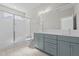 Bathroom featuring double sink vanity, a tiled floor and a frameless glass shower with a bench at 716 Jamescroft Way # 28, Rolesville, NC 27571