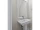 Bathroom features a pedestal sink with white frame mirror, chrome faucet and towel ring at 716 Jamescroft Way # 28, Rolesville, NC 27571