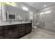 Bathroom with double vanity, framed mirror, a tiled shower with glass door, and elegant finishes at 716 Jamescroft Way # 28, Rolesville, NC 27571