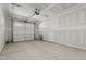 Unfinished garage featuring concrete slab floor, drywall, and a new garage door at 716 Jamescroft Way # 28, Rolesville, NC 27571