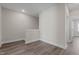Hallway area features neutral walls, modern baseboards and trim plus wood-look flooring at 716 Jamescroft Way # 28, Rolesville, NC 27571