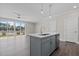 Spacious kitchen featuring a grey island, stainless steel appliances, and open access to living area at 716 Jamescroft Way # 28, Rolesville, NC 27571