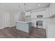 Bright kitchen featuring grey island, stainless steel appliances, and white cabinetry at 716 Jamescroft Way # 28, Rolesville, NC 27571