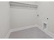 Laundry room has gray tiled floor, with a shelf, and electric/water hook ups at 716 Jamescroft Way # 28, Rolesville, NC 27571