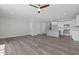 Open living space with kitchen, wood floors, ceiling fan, recessed lighting, and natural light at 716 Jamescroft Way # 28, Rolesville, NC 27571