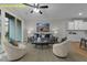 Inviting living room with ample seating, stylish decor, a ceiling fan, and seamless flow to the kitchen at 716 Jamescroft Way # 28, Rolesville, NC 27571