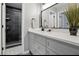 Updated bathroom with stylish vanity, quartz countertops, and tiled shower at 7708 Falcon Rest Cir, Raleigh, NC 27615