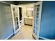 Modern bathroom featuring a vanity with black hardware, a mirror, and tiled flooring at 7708 Falcon Rest Cir, Raleigh, NC 27615