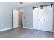 Bedroom with sliding door closet and light gray walls at 7708 Falcon Rest Cir, Raleigh, NC 27615