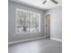 Bedroom with light gray walls, ceiling fan, and large window for ample natural light at 7708 Falcon Rest Cir, Raleigh, NC 27615