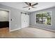 Bedroom featuring sliding closet doors and a window providing natural light at 7708 Falcon Rest Cir, Raleigh, NC 27615