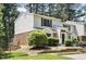 Charming townhouse displaying traditional architecture with a manicured front lawn and entryway at 7708 Falcon Rest Cir, Raleigh, NC 27615