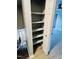 Hallway closet with shelving provides additional storage on the way to the living area at 7708 Falcon Rest Cir, Raleigh, NC 27615