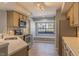 Bright kitchen with stainless appliances, tile backsplash, window seat, and wood flooring at 7708 Falcon Rest Cir, Raleigh, NC 27615