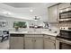 Modern kitchen featuring stainless steel appliances and a cozy dining area at 7708 Falcon Rest Cir, Raleigh, NC 27615