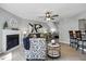 Open-concept space with fireplace, work nook, kitchen bar and stylish décor at 7708 Falcon Rest Cir, Raleigh, NC 27615