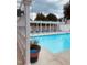 Inviting community pool with lounge chairs and shade for relaxation and enjoyment at 7708 Falcon Rest Cir, Raleigh, NC 27615