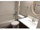 Bathroom with modern fixtures including a combined shower and tub, sink, and vanity at 7746 Kingsberry Ct, Raleigh, NC 27615