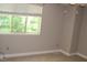Bright bedroom featuring neutral carpet, a window and neutral paint at 7746 Kingsberry Ct, Raleigh, NC 27615