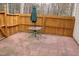 Outdoor patio area with brick pavers, wooden fence, and a table with umbrella for shade at 7746 Kingsberry Ct, Raleigh, NC 27615