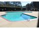 Well-maintained community pool with clear water and surrounding patio area for relaxing and socializing at 7746 Kingsberry Ct, Raleigh, NC 27615