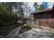 Backyard landscaped walkway, small shed, and side of house at 817 Glen Eden Dr, Raleigh, NC 27612