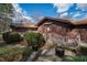 Backyard with a small landscaped area, steps and wooden railing to the house at 817 Glen Eden Dr, Raleigh, NC 27612