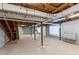 Unfinished basement with concrete floor, utilities, support columns, and block walls at 817 Glen Eden Dr, Raleigh, NC 27612