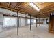 Large unfinished basement featuring concrete walls, wooden ceiling, and support beams at 817 Glen Eden Dr, Raleigh, NC 27612