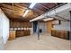 Unfinished basement with exposed ductwork, cabinets, and block walls at 817 Glen Eden Dr, Raleigh, NC 27612