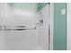 Bathroom with white tiled walls and shower behind frosted glass at 817 Glen Eden Dr, Raleigh, NC 27612