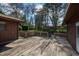 Expansive wooden deck area for outdoor entertaining and enjoyment on a lovely day with mature landscaping at 817 Glen Eden Dr, Raleigh, NC 27612