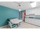 Bright kitchen with dining area, featuring white cabinets, turquoise countertops, and comfortable seating at 817 Glen Eden Dr, Raleigh, NC 27612
