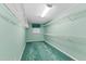 A walk-in closet with seafoam-green walls, metal racks, and a small window at 817 Glen Eden Dr, Raleigh, NC 27612