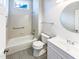 Updated bathroom with tub and shower combination, white vanity, and large mirror at 9100 Palm Bay Cir, Raleigh, NC 27617