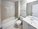 Well-lit bathroom featuring a bathtub, shower, vanity with sink, and toilet at 9100 Palm Bay Cir, Raleigh, NC 27617