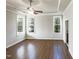 Bright bedroom featuring large windows and hardwood floors, creating a cozy and inviting atmosphere at 9100 Palm Bay Cir, Raleigh, NC 27617