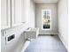 Functional laundry room with sink, cabinets and a window view at 9100 Palm Bay Cir, Raleigh, NC 27617