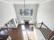 Bright living room featuring a high ceiling, fan, fireplace, and plenty of natural light at 9100 Palm Bay Cir, Raleigh, NC 27617