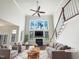 Bright living room features a fireplace, large windows and beautiful hardwood floors at 9100 Palm Bay Cir, Raleigh, NC 27617