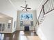 Bright living room boasts a fireplace, large windows, hardwood floors and a staircase at 9100 Palm Bay Cir, Raleigh, NC 27617