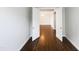 Open living room with hardwood floors and large doorway at 9100 Palm Bay Cir, Raleigh, NC 27617