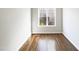 Room with wood floor and window with grid pattern at 9100 Palm Bay Cir, Raleigh, NC 27617