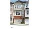 Charming townhome featuring brick accents, neutral siding, and an attached one car garage at 10010 Secluded Garden Drive Rd # 183, Apex, NC 27523