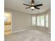Sunlit bedroom featuring carpet, a ceiling fan, and an ensuite bathroom at 102 Ventura Woods Ct, Wake Forest, NC 27587
