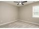 Empty bedroom featuring a ceiling fan and gray carpet at 102 Ventura Woods Ct, Wake Forest, NC 27587
