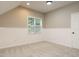 Cozy bonus room with neutral carpet, natural light, and white wainscoting at 102 Ventura Woods Ct, Wake Forest, NC 27587